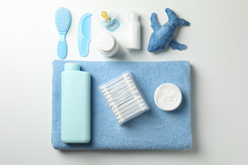 Flat lay with baby hygiene accessories on white background