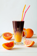Detox citrus, banana and blueberry smoothie. Healthy food or vegetarian concept. Selective focus