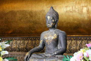 Worn sitting Buddha from Thailand