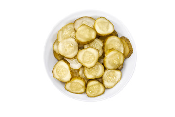 pickled cucumber in a ceramic bowl isolated on white background, top view.