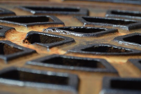 Close-up Of Metallic Manhole Cover