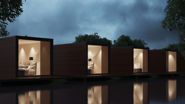 The hotel is not a river bank of transport containers. Night lighting. 3D rendering.