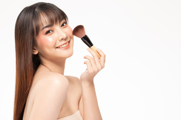 Beauty asian woman  brown hair looking smile in camera happiness and hold make up brush  and cheerful with make up brush,Beauty Concept on white background.