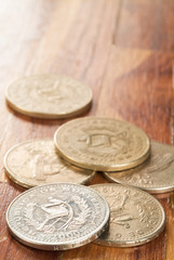 Some scattered Quetzal coins, the official currency of Guatemala.