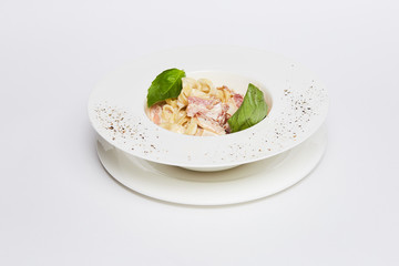 pasta tagliatelle with bacon of food on a table