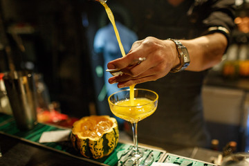 the bartender prepares a cocktail in the style of Halloween