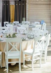 Wedding dinner decor, laid table with plate, Wedding calligraphy card, eucalyptus flower branch, view frome above