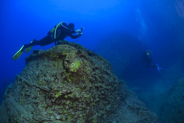 Underwater wide angle photography (chain and lots of silver fish under the boat) Fethiye, Turkey.