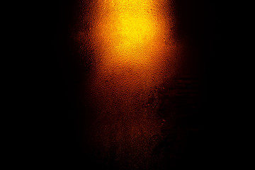 Fototapeta na wymiar Texture of water drops on the bottle of beer,Macro beer surface 