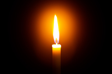 Candle light on black background ,Single lit candle with quite flame 