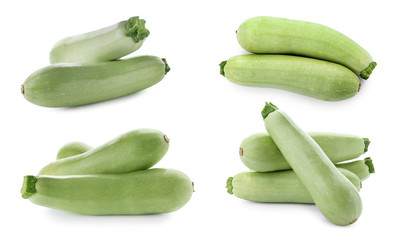 Set of fresh ripe zucchinis on white background