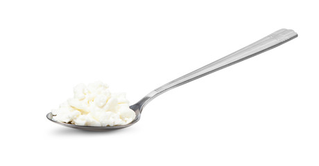 Cottage cheese in spoon isolated on white background