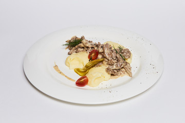 a potatoes puree plate with cream mushrooms