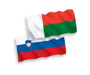Flags of Slovenia and Madagascar on a white background