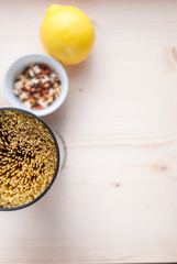 tin can pasta, lemon and spices on a torn table top view