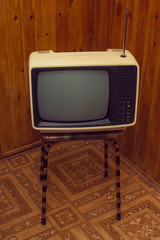 Retro soviet portable analog tv on stool