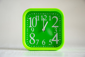 green clock on white background