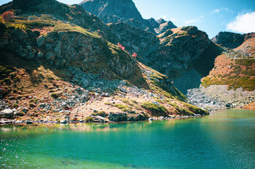 Сlear emerald lake in mountains. Arkhyz, Karachay-Cherkessia