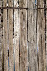 Fence from old wooden boards as an abstract background.