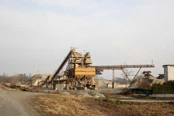 Fototapeta na wymiar sand and gravel quarry with a conveyor belt with copy space for your text