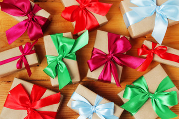 Gifts packed with craft paper and colorful satin ribbons