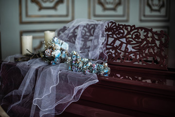 wilted bouquet lies  on the piano