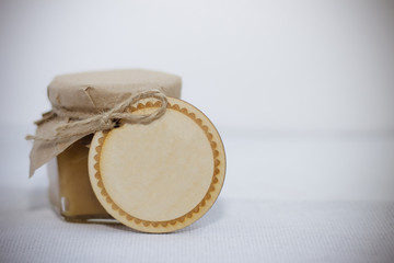 Jar of honey on wooden table