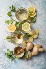 Lemon and ginger tea with honey. Healthy ingredients against cold. Top view image  with copy space. get rid of toxins and boost.