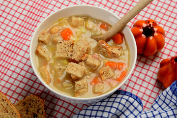 home made potato soup in a bowl with pieces of dry bread