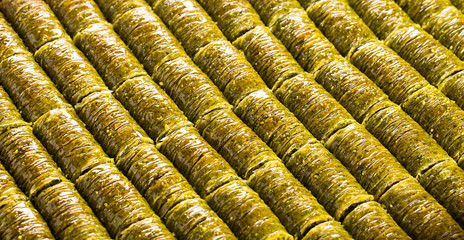 Traditional turkish baklava with roll-shaped pistachio.
