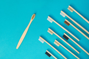 Wooden toothbrushes on a blue background. zero waste concept. dental care without platysik.