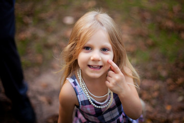 Portrait of smiling little girl walking outdoors