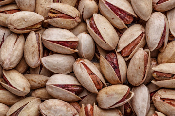 Pistachios texture and background . Tasty pistachios as background,as pistachios texture.Concept of nuts. flat lay
