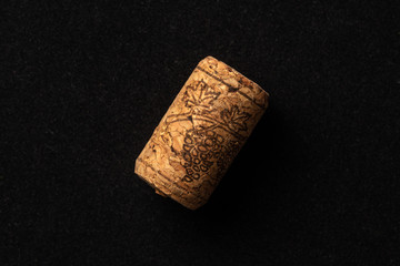 One cork stopper for wine bottle over black background