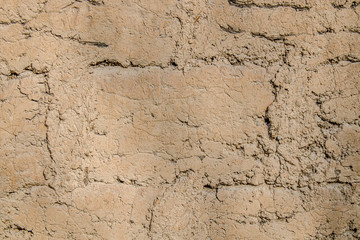 Clay wall collapses as an abstract background