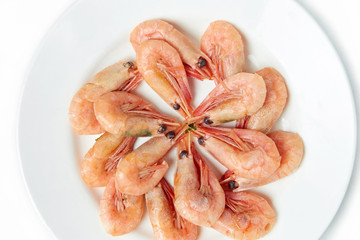 shrimp in a plate on a white isolated background