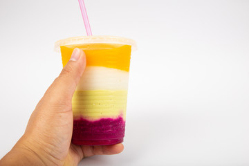 Man hand holding a cup Fresh delicious Mix Fruit juice 