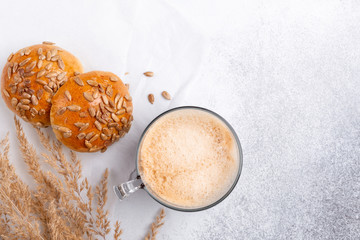 Coffee and fresh homemade buns. Breakfast with coffee and pastries. Scandinavian style. Minimalism. Top view
