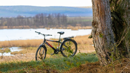 Fototapeta premium Bicycle on the river background, outdoor activities