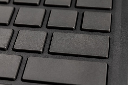 gray keyboard keys of a personal computer or laptop close - up without inscriptions with free space for your text, blank, design, copy space, mock up