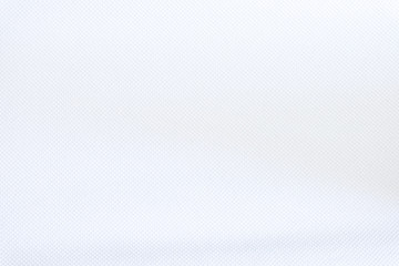 Fototapeta premium White fabric close up shot of Cotton and polyester shirt. Casual wear over the weekend or summer time season. Background texture concept with copy space for text.
