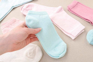 The woman arranges the washed socks.