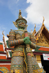 Figure of a giant colored warrior at the Grand Palace in Bangkok
