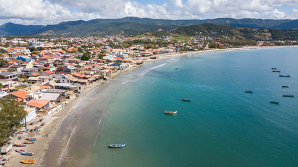 Fototapeta na wymiar Aerial view of the city and beach of Garopaba, in Santa Catarina, Brazil