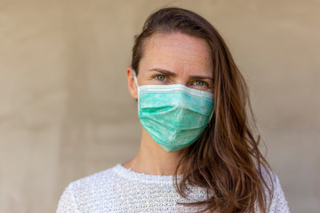 Woman wearing face protection mask for covid-19 protection