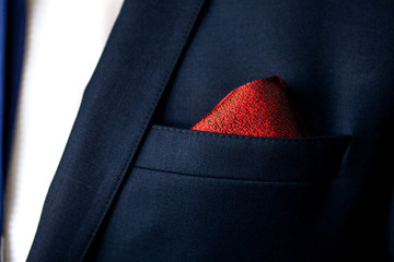 Men's pocket square close up. Male marriage suit closeup. Style for a very special day. Male in blue suit set tie closeup.