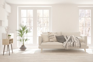 White living room with sofa and winter landscape in window. Scandinavian interior design. 3D illustration