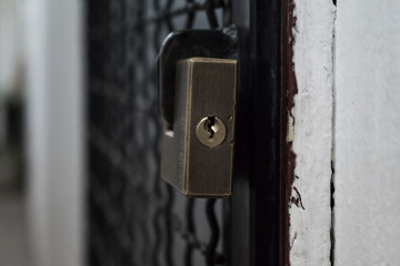 Closed Store due to Coronavirus pandemic. Locked Store Door with Padlock