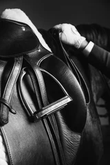 Stof per meter Horse rider saddle up the thoroughbred horse for dressage or equestrian race © serhiipanin