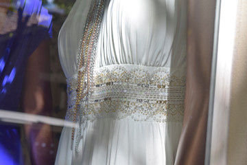 Fototapeta na wymiar white wedding dress on a hanger